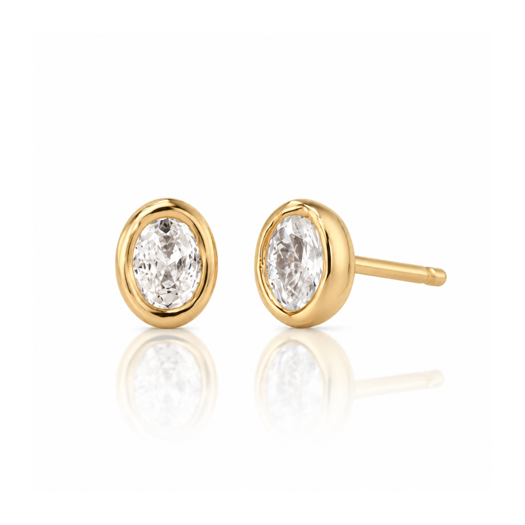 Sutton bezel stud earrings with oval simulated diamond in gold – designed in Vermont by Elli Parr