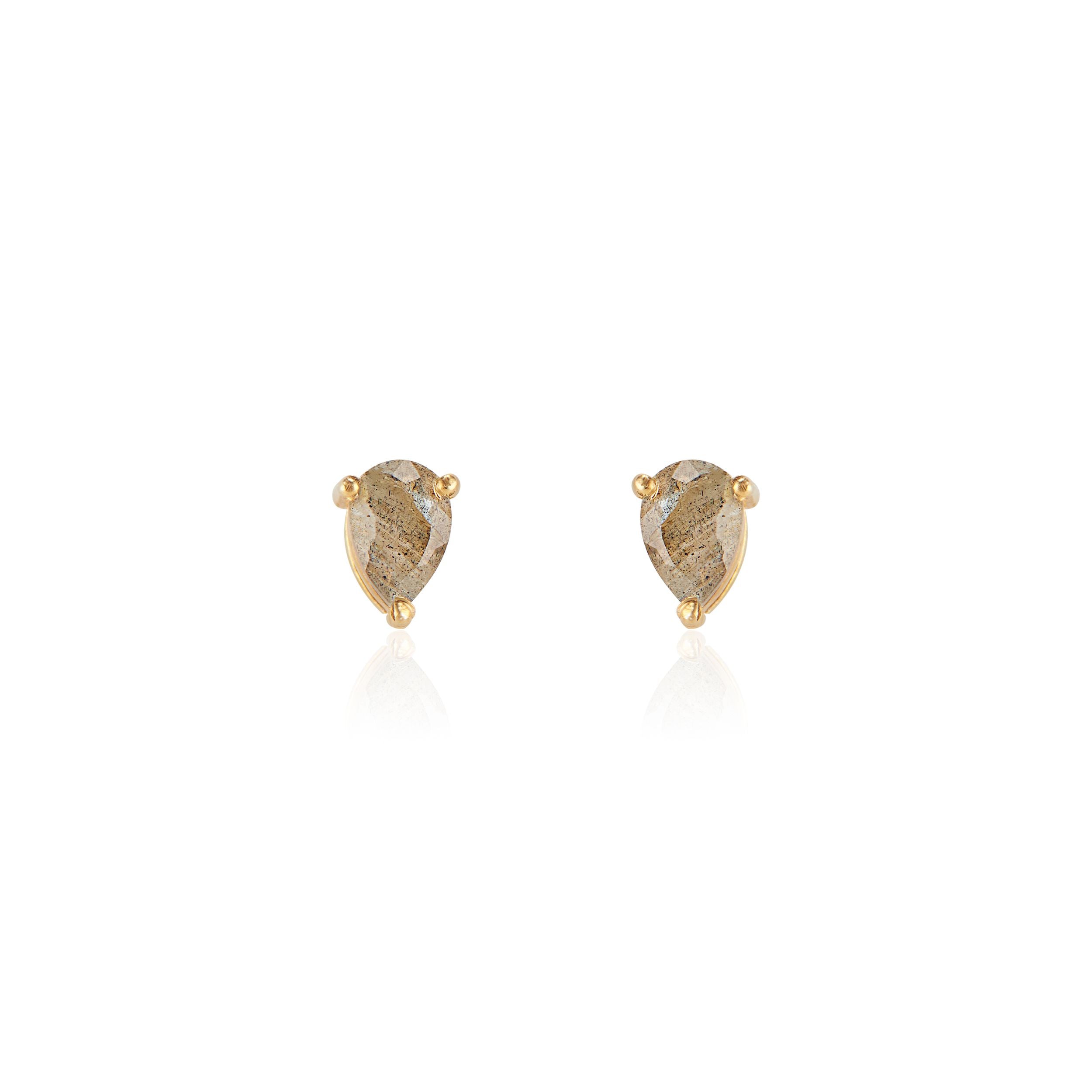 Close-up of elegant labradorite teardrop stud earrings set in 14K gold vermeil displayed on a neutral-toned fabric background. The polished labradorite stones are cut in a teardrop faceted shape, reflecting light for a subtle shine—handcrafted minimalist jewelry made in Vermont from Elli Parr.